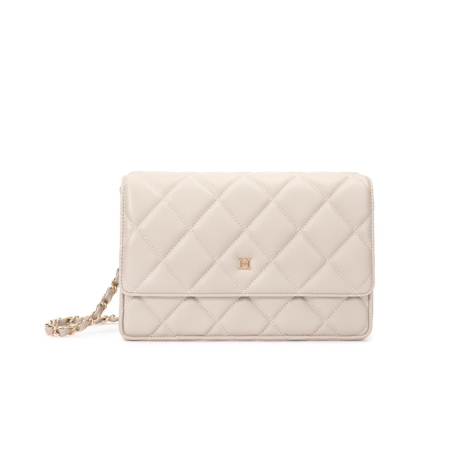 Skinnveske med quiltet mønster Sand