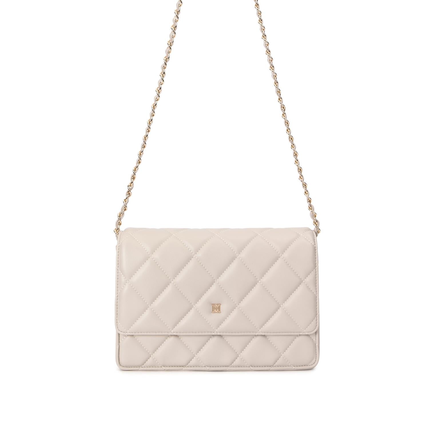 Skinnveske med quiltet mønster Sand